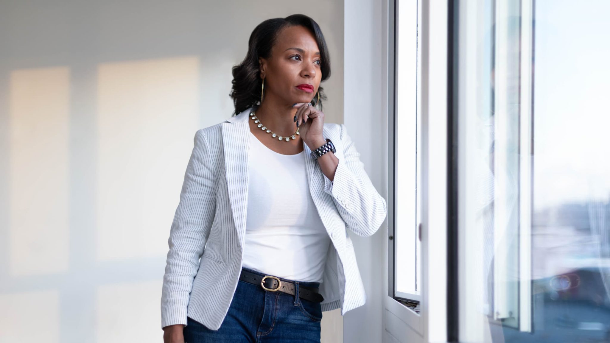 A woman looking out of the window pondering life